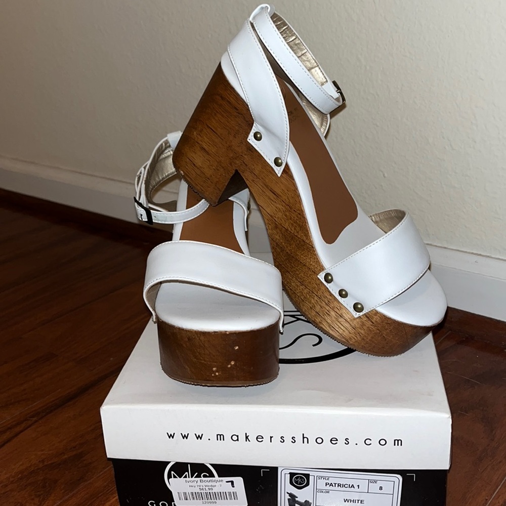 New with box.  Never worn. Wooden platform sandals